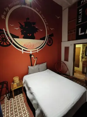 Cama o camas de una habitación en Chuchumbé Hotel & Hostal