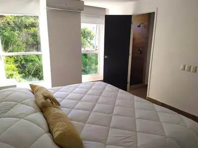 Cama o camas de una habitación en Departamento con Preciosa Vista al Mar en Acapulco Diamante