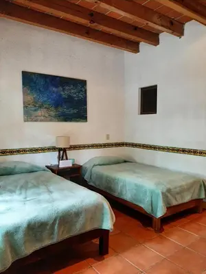 Cama o camas de una habitación en Santuario Jardín de la Abundancia