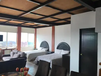 Cama o camas de una habitación en Vista Taxco