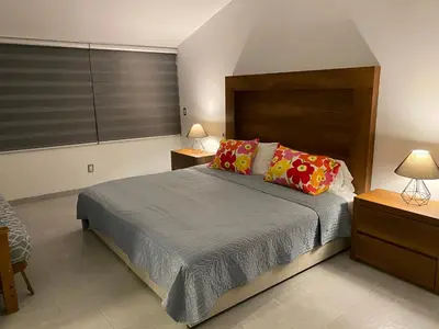 Cama o camas de una habitación en Casa de las Palmeras Lomas de Cocoyoc