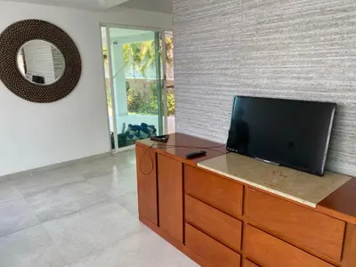 Una televisión o centro de entretenimiento en Casa de las Palmeras Lomas de Cocoyoc