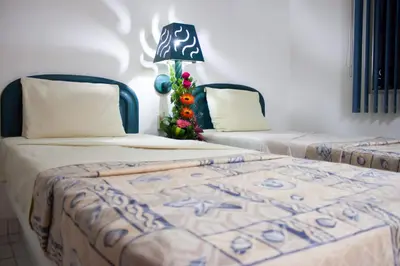 Cama o camas de una habitación en Coral Clubes Acapulco