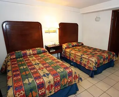 Cama o camas de una habitación en Hotel Calenda