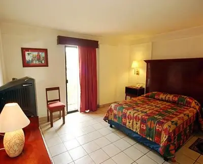 Cama o camas de una habitación en Hotel Calenda