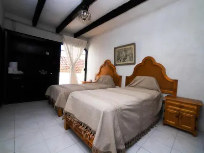Cama o camas de una habitación en Casa de las Cruces Taxco