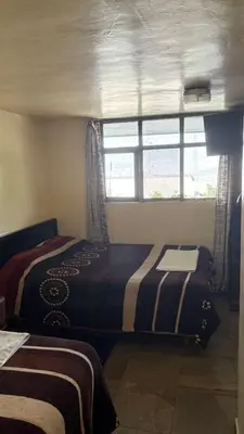 Cama o camas de una habitación en Hotel Zaragoza