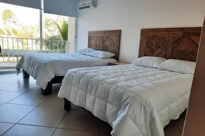 Cama o camas de una habitación en Departamento 105 , paraiso del pacifico