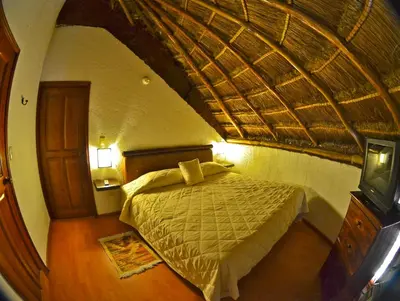 Cama o camas de una habitación en La Aldea Hotel & Spa