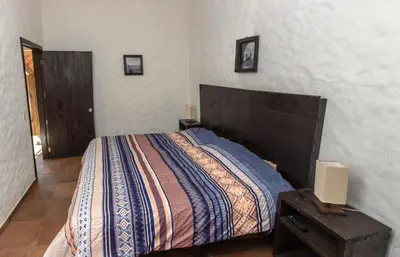 Cama o camas de una habitación en Hostal Maria Tepozteca