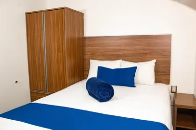 Cama o camas de una habitación en La Casa Azul (Zona de Hospitales)
