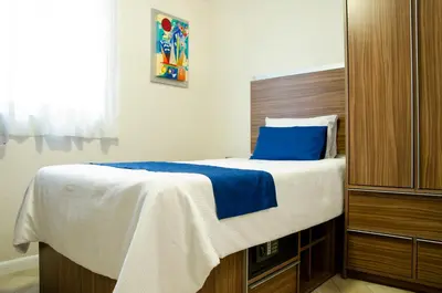 Cama o camas de una habitación en La Casa Azul (Zona de Hospitales)