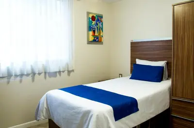 Cama o camas de una habitación en La Casa Azul (Zona de Hospitales)