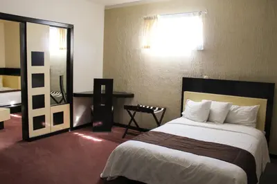 Cama o camas de una habitación en Hotel Cancalli Tlaxcala