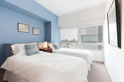 Cama o camas de una habitación en Parque Sur Beautiful apartment 2 BE - 2 BA - 2 Parkings