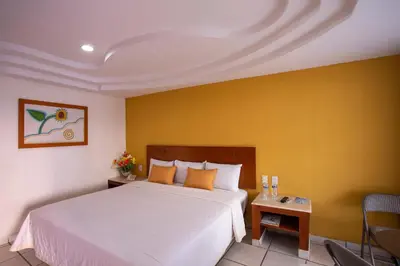 Cama o camas de una habitación en Hotel Arcos Aeropuerto