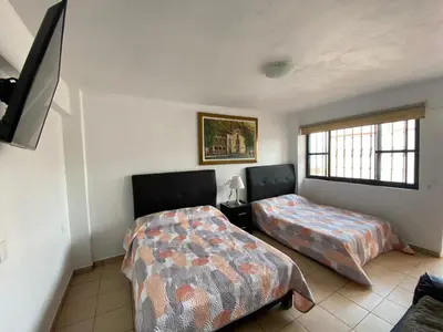 Cama o camas de una habitación en Casa Vista hermosa de taxco