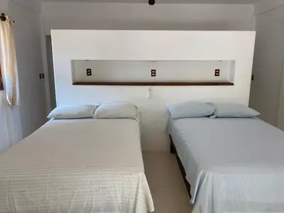 Cama o camas de una habitación en Cabañas las Palmas Chacahua