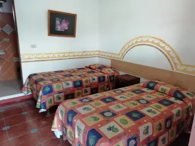 Cama o camas de una habitación en Posada Los Naranjos