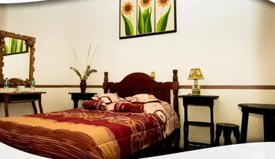 Cama o camas de una habitación en Posada Acaxiloco