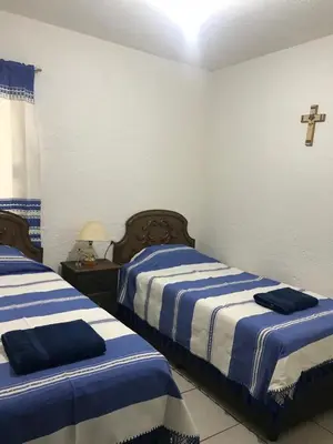 Cama o camas de una habitación en Departamento la crucecita, con aire acondicionado, excelente ubicación, en segunda planta