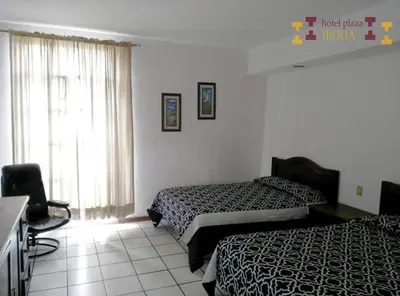 Cama o camas de una habitación en Hotel Plaza Iberia