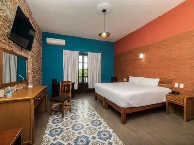 Cama o camas de una habitación en Hotel Meson del Barrio
