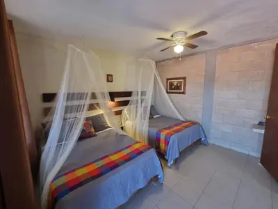 Cama o camas de una habitación en Hotel Posada Rancho Los Laureles