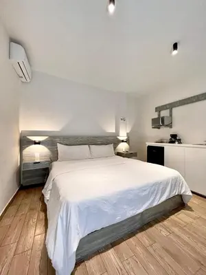 Cama o camas de una habitación en Capital Suites