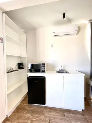Una cocina o zona de cocina en Capital Suites