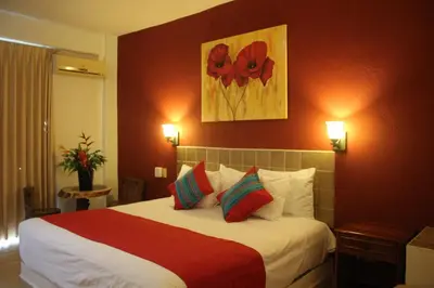 Cama o camas de una habitación en Hotel Arenas del Pacifico