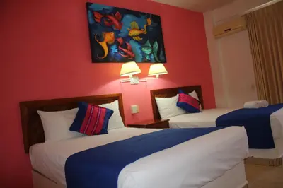Cama o camas de una habitación en Hotel Arenas del Pacifico
