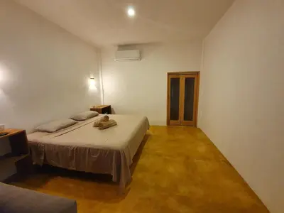 Cama o camas de una habitación en LUNA DE MIEL con aire acondicionado