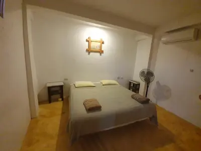 Cama o camas de una habitación en LUNA DE MIEL con aire acondicionado