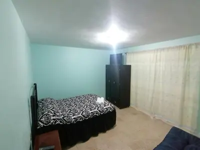 Cama o camas de una habitación en DEPARTAMENTO CERCANO AL AEROPUERTO T2, A 2 CALLES