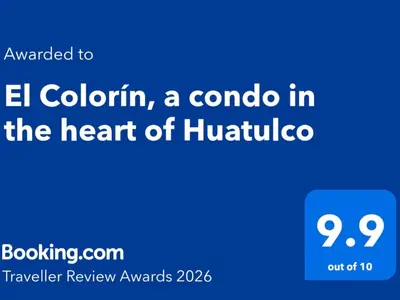 Certificado, premio, señal o documento que está expuesto en El Colorín, a condo in the heart of Huatulco