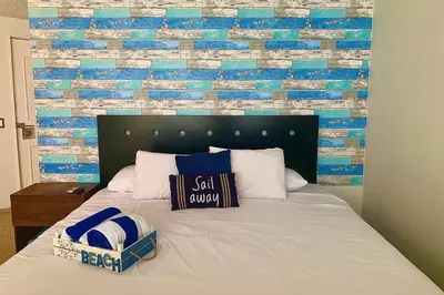 Cama o camas de una habitación en Loft con vista al mar y acceso a playa