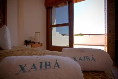 Cama o camas de una habitación en HOTEL VILLAS XAIBA