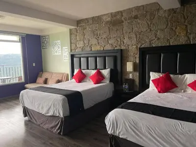 Cama o camas de una habitación en Vista Zacatlan Hotel