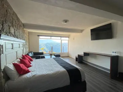 Cama o camas de una habitación en Vista Zacatlan Hotel