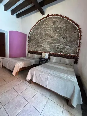 Cama o camas de una habitación en HOTEL BACANTES