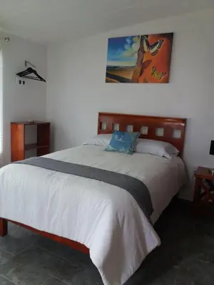 Cama o camas de una habitación en ANBAROA VILLAS