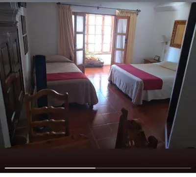 Cama o camas de una habitación en Hotel Mi Casita