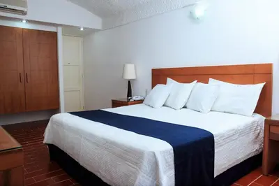 Cama o camas de una habitación en Hotel Calli