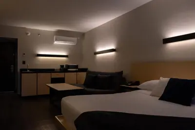 Cama o camas de una habitación en BV Hotel Atlixco
