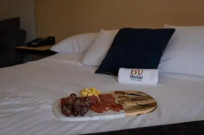 Cama o camas de una habitación en BV Hotel Atlixco