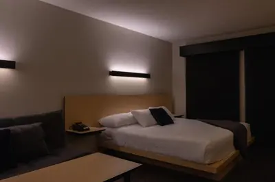 Cama o camas de una habitación en BV Hotel Atlixco