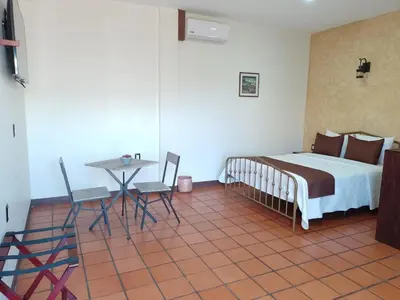 Cama o camas de una habitación en Casa de las flores Hotel Boutique