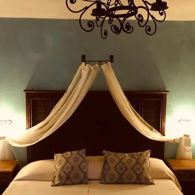 Cama o camas de una habitación en La Escondida Hotel Boutique