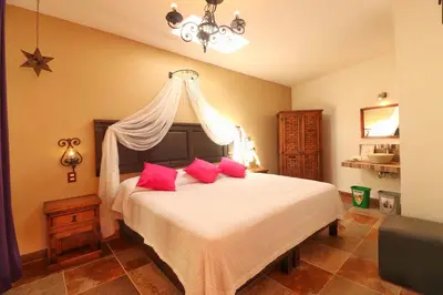 Cama o camas de una habitación en La Escondida Hotel Boutique
